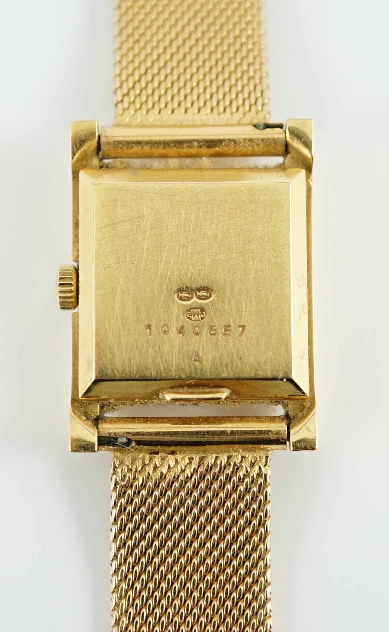 A lady's 18ct gold Jaeger LeCoultre Voguematic automatic rectangular wrist watch, on an associated Middle Eastern gold mesh link bracelet